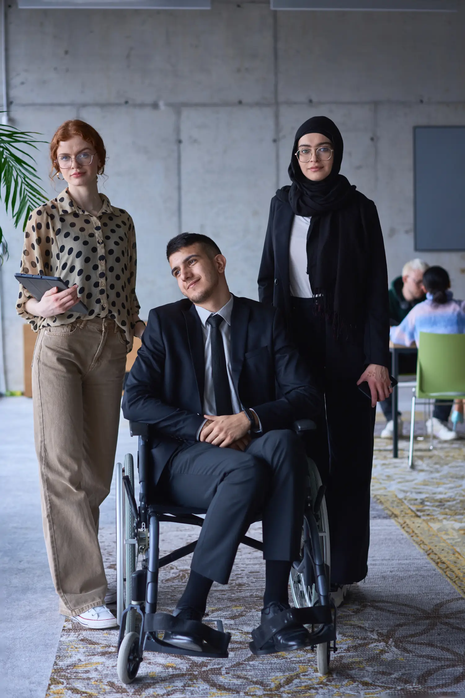 A businessman with disability in a wheelchair is included