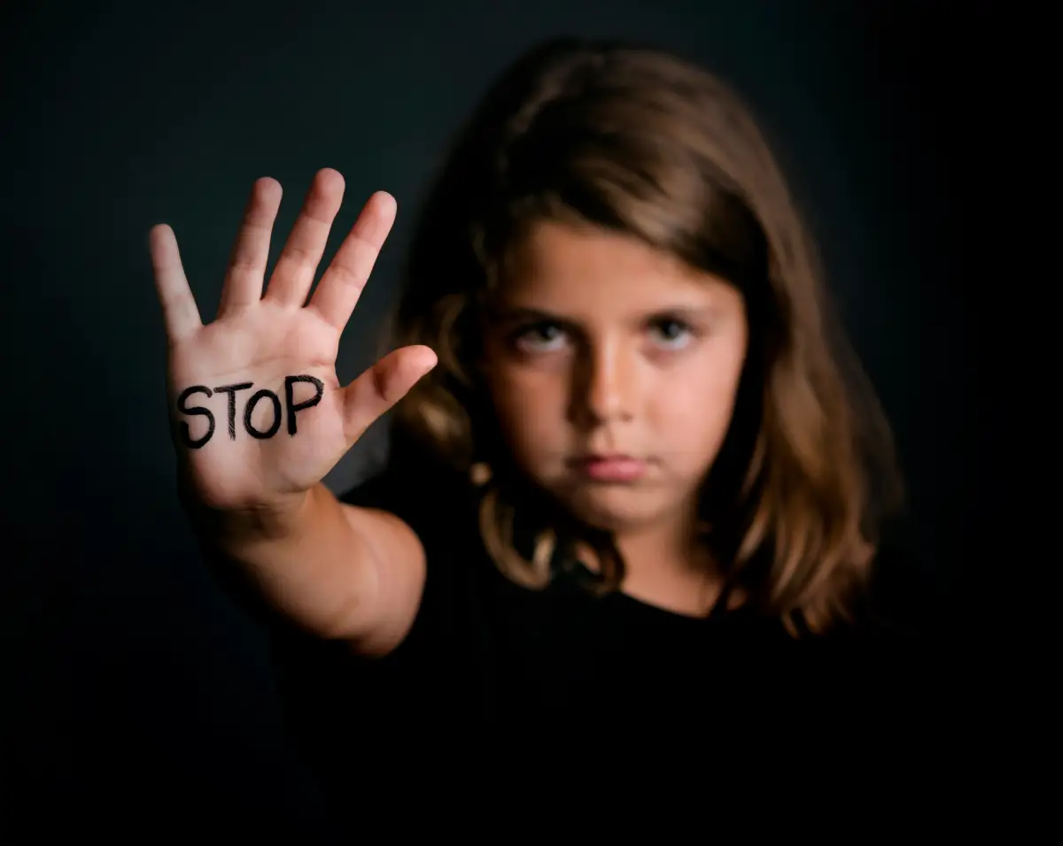 An angry girl showing hand signaling to stop violence